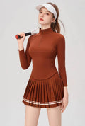 OZERO Reddish Brown quarter-zip golf shirt and pleated skirt on model