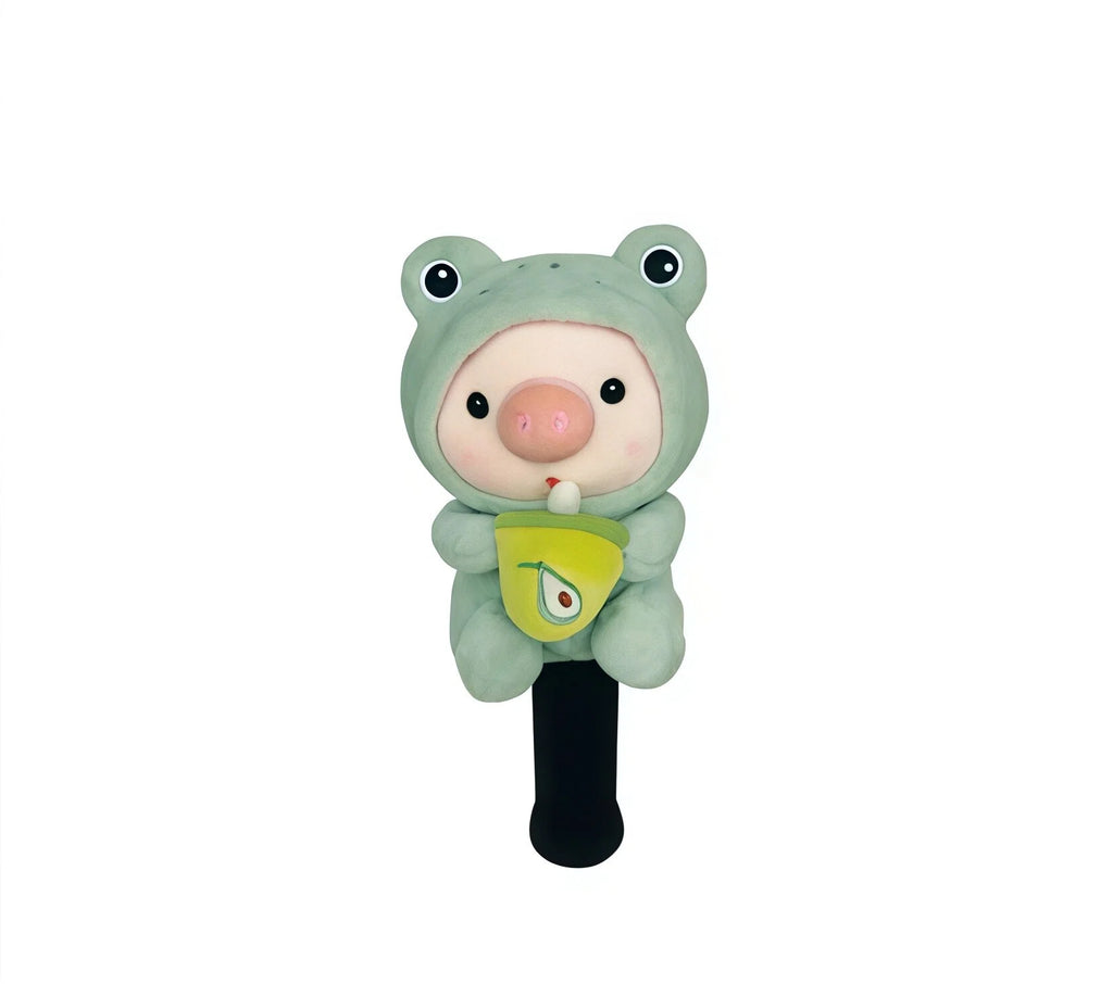 Mint green frog-hooded cartoon pig golf fairway wood headcover clutching a pear-print boba cup, on black knit sleeve