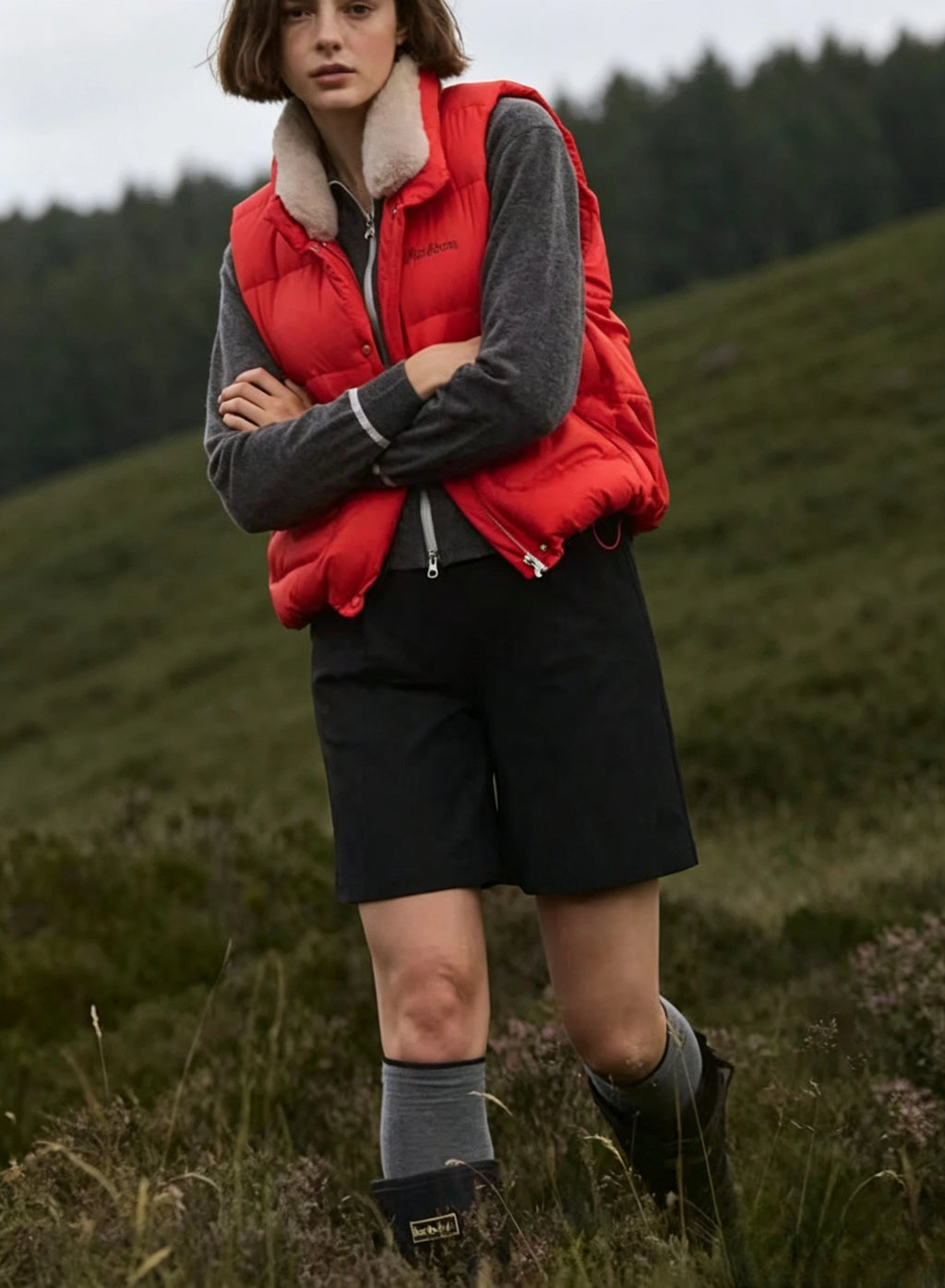Malbon Golf Women’s Lightweight Thermal Down Vest orange model side view