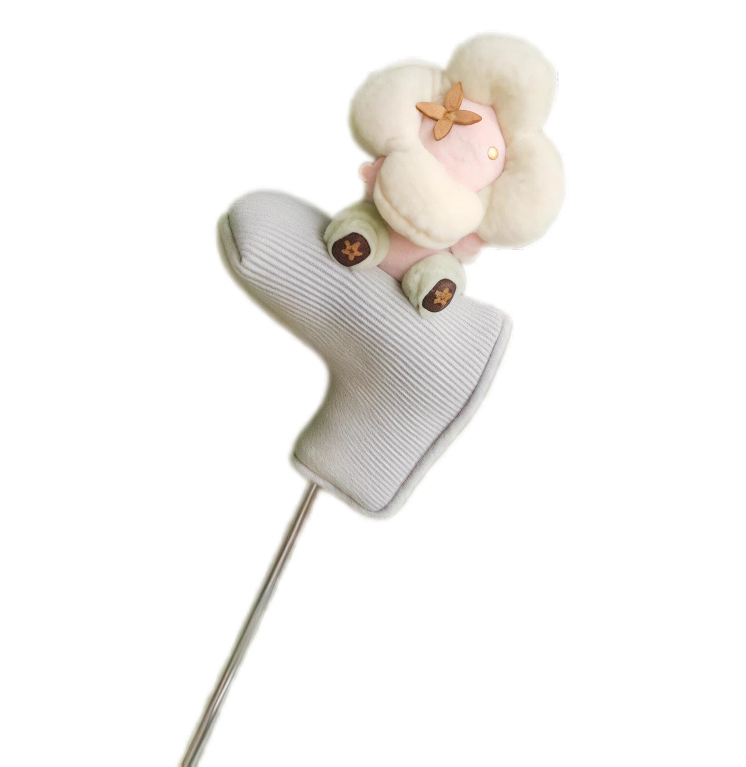 Cream flower plush sitting atop a grey ribbed knit golf putter headcover, brown monogram petal detail in centre