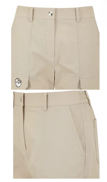 Malbon Women's Straight-Leg Golf Pants — waistband and zip fly close-up