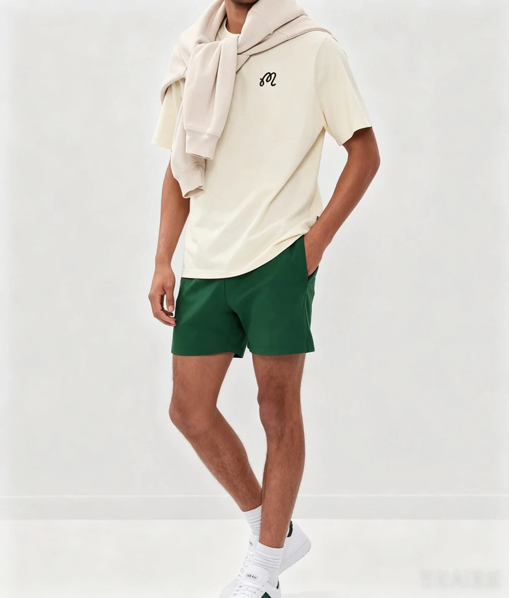 Malbon beige graphic T-shirt styled golf outfit