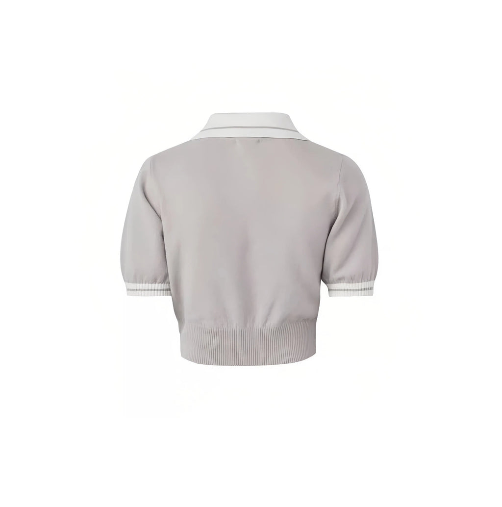 Malbon women knit golf polo placket and button close-up