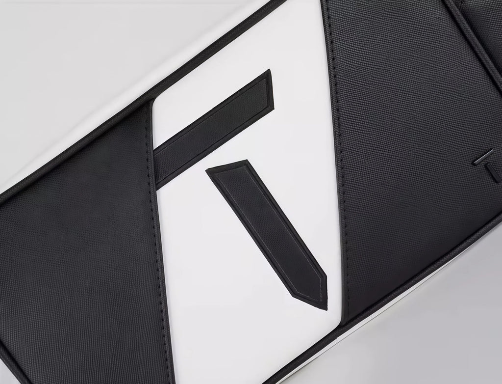 High-resolution close-up of the European Tour golf pouch highlighting the textured stitching and layered design of the "T" logo. Crafted with precision and premium materials.