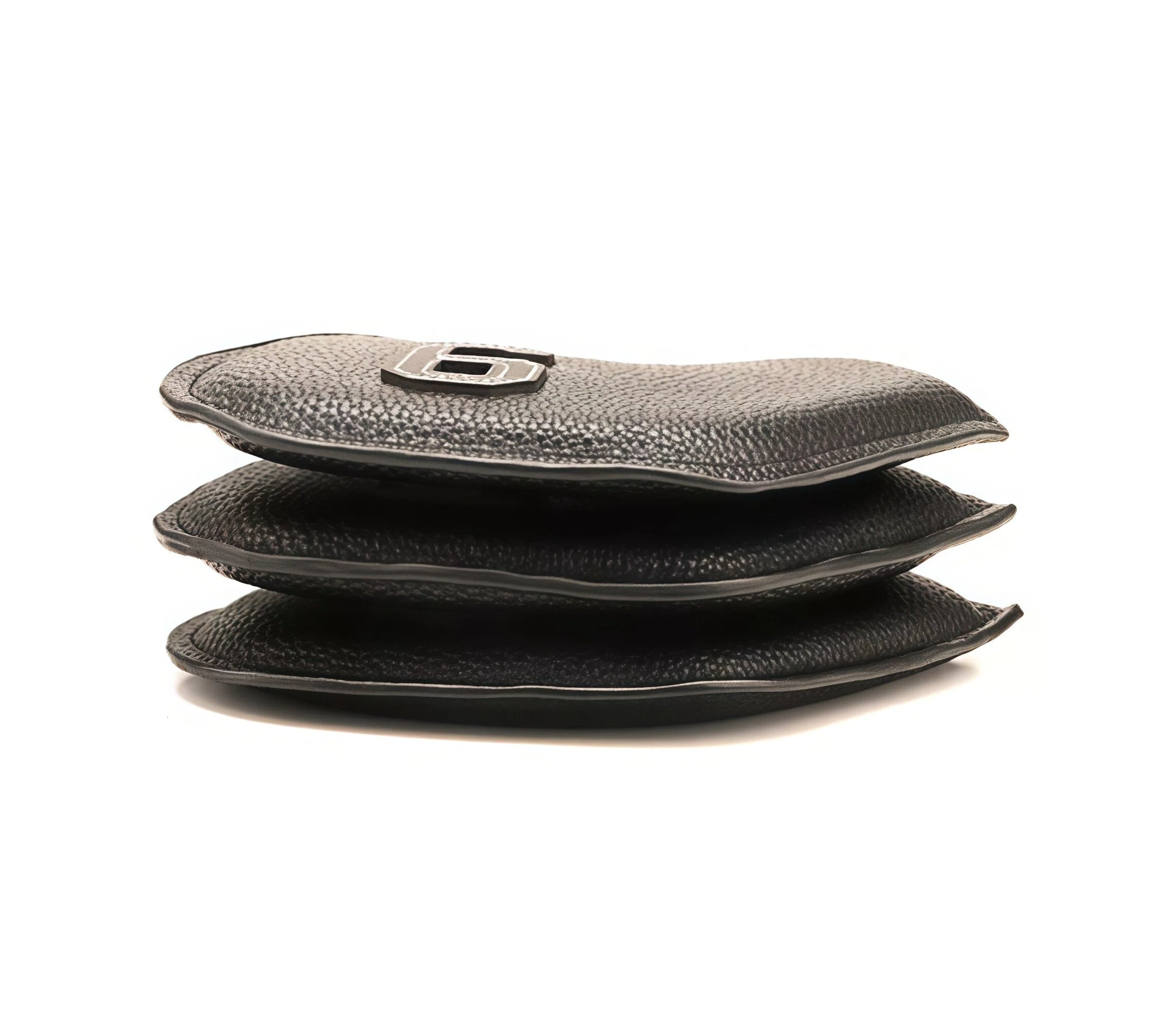 Side view stack of three black PU iron headcovers highlighting pebbled texture, padded interior, and smooth oil-finished edges — designed for premium feel and long-term wear resistance on the course or in travel bags