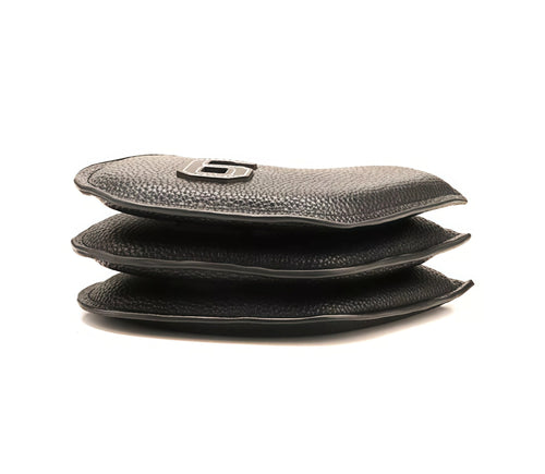 Stack of black PU iron headcovers showing textured outer surfaces