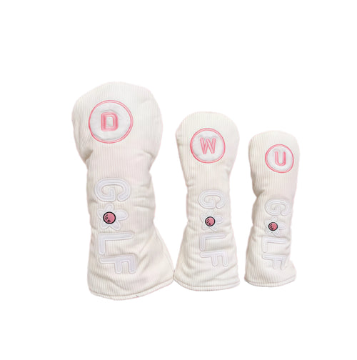 White corduroy golf headcovers set with pink flower accents and立体GOLF letters, designed for driver, fairway and utility clubs with durable protection.