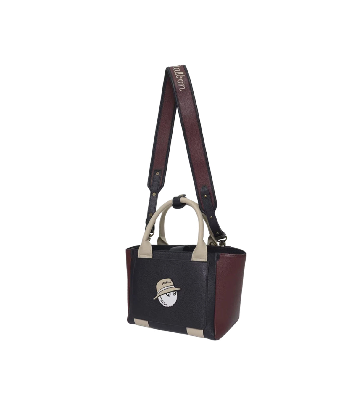 Angled front view of the Malbon mini tote bag showcasing its black and burgundy synthetic leather construction, beige top handles, and embroidered golf ball character patch. Ideal for casual and golf lifestyle use.
