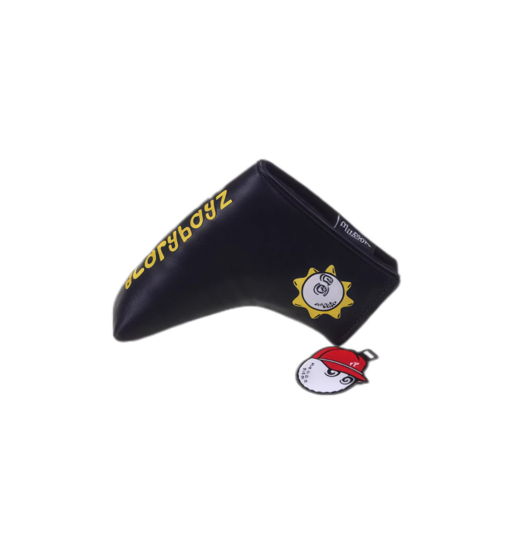 Angled shot of black Malbon Gloryboyz putter headcover with bold yellow “Gloryboyz” text on side and small sun logo on front — includes red-capped magnetic ball clip and soft interior lining for club protection.