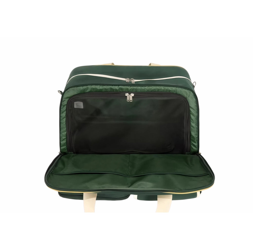 Top-down view of green Malbon golf duffle bag interior showing large main compartment, black zippered inner pocket, and branded label with "Malbon" logo