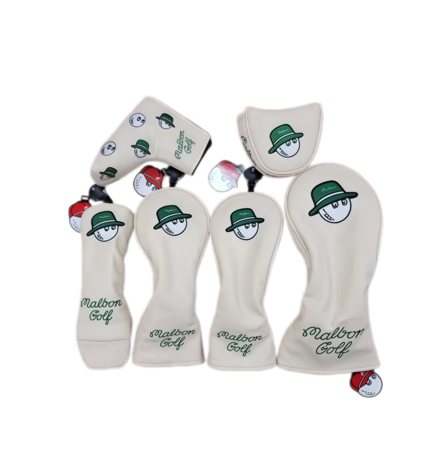 Top-down view of cream Malbon golf headcover set showing patterned iron cover with repeating bucket hat characters, alongside solid driver and putter covers — each with red-capped magnetic clip accessory.

