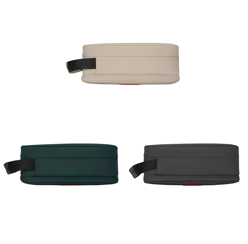 Top-down view of three Malbon golf handheld storage bags in beige, dark green, and black. Showcasing clean lines and slim profile for easy portability.