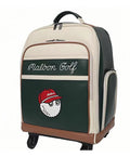 Side angle of Malbon Golf wheeled backpack showing cream and dark green color block design, embroidered "Malbon Golf" script, and animated golf ball logo