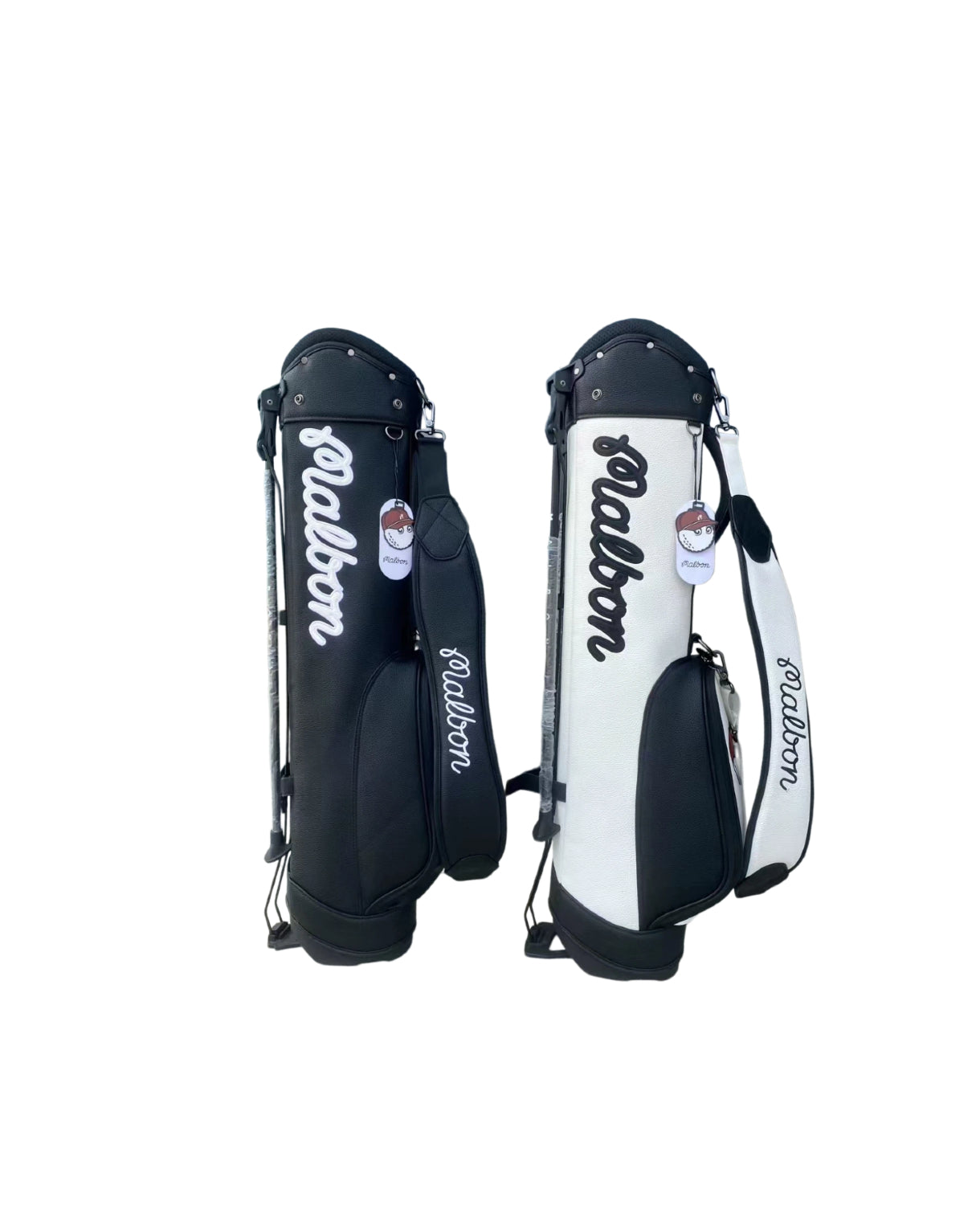 Side-by-side view of black and white Malbon Golf Stand Bags, highlighting their matching waterproof PU construction, signature "Malbon" branding, and dual hat holders with character-themed zipper pulls.