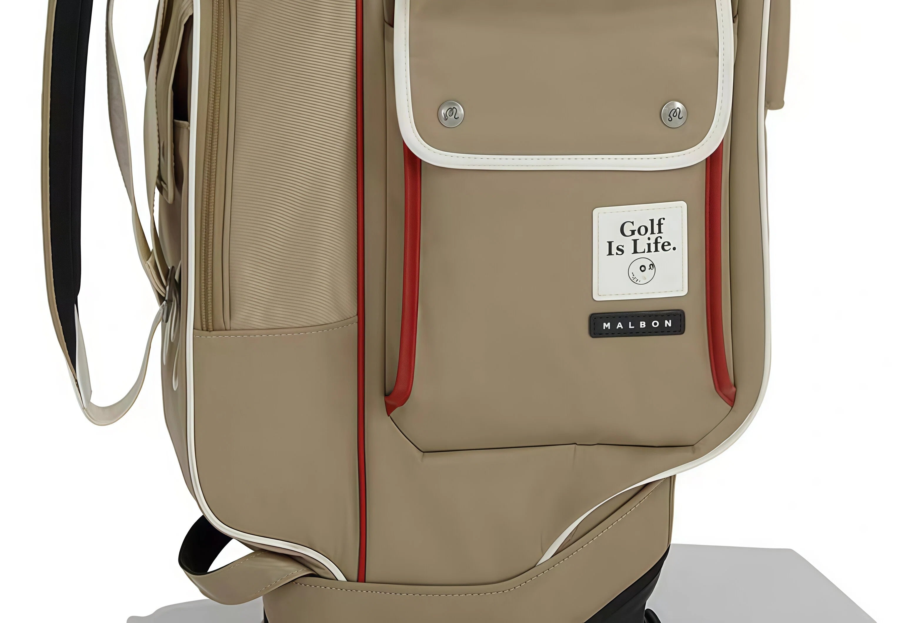 Close-up of Malbon Golf stand bag showing "Golf Is Life" patch, black "MALBON" logo tag, red piping, and textured PU leather material.