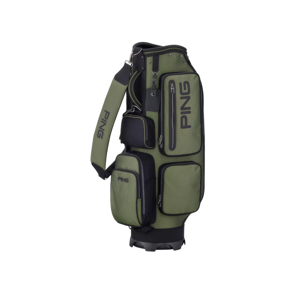 Olive green and black PING modern cart bag featuring multiple compartments, padded shoulder strap, and sturdy base. Designed for comfort and organization.