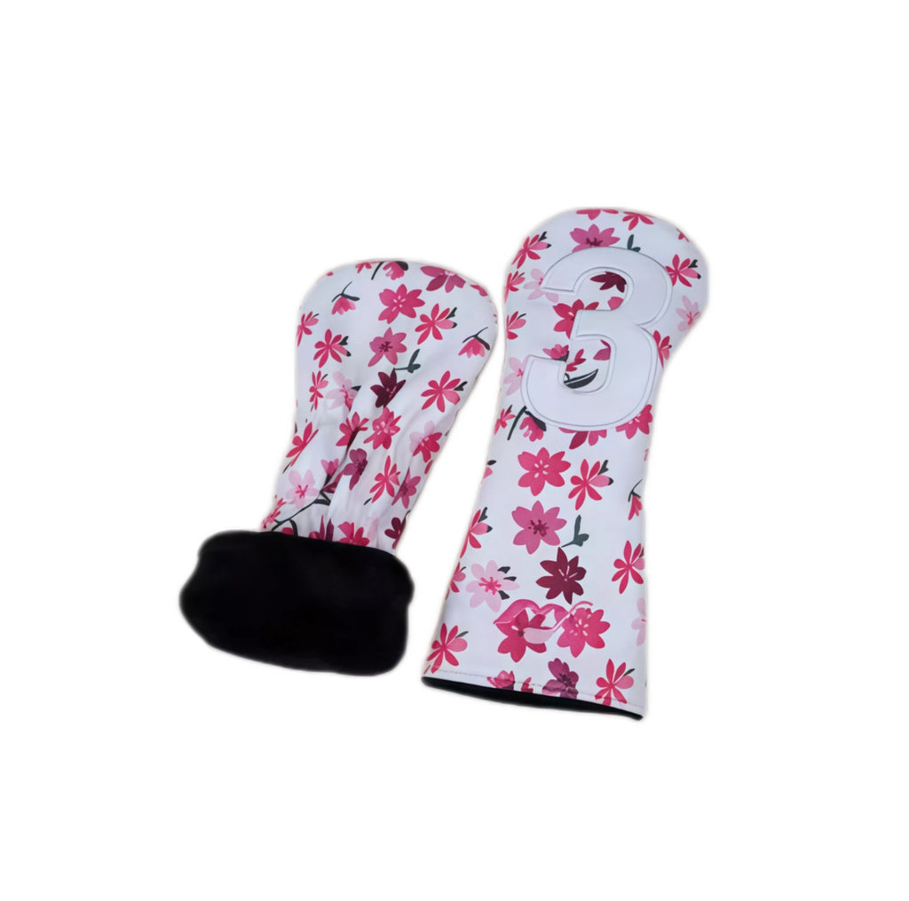 Detailed view of white Sakura golf headcover (#3 fairway wood) showing floral print texture, embossed number “3”, and plush black interior lining designed to protect club finish from scratches and wear.