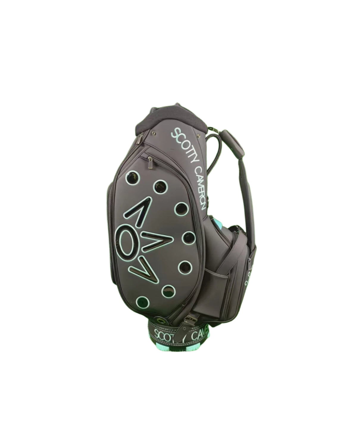 Angled rear view of the Scotty Cameron Supercar Staff Bag, highlighting the 'SCOTTY CAMERON' text on the hood, the side pocket construction, and the integrated dual-strap system.

