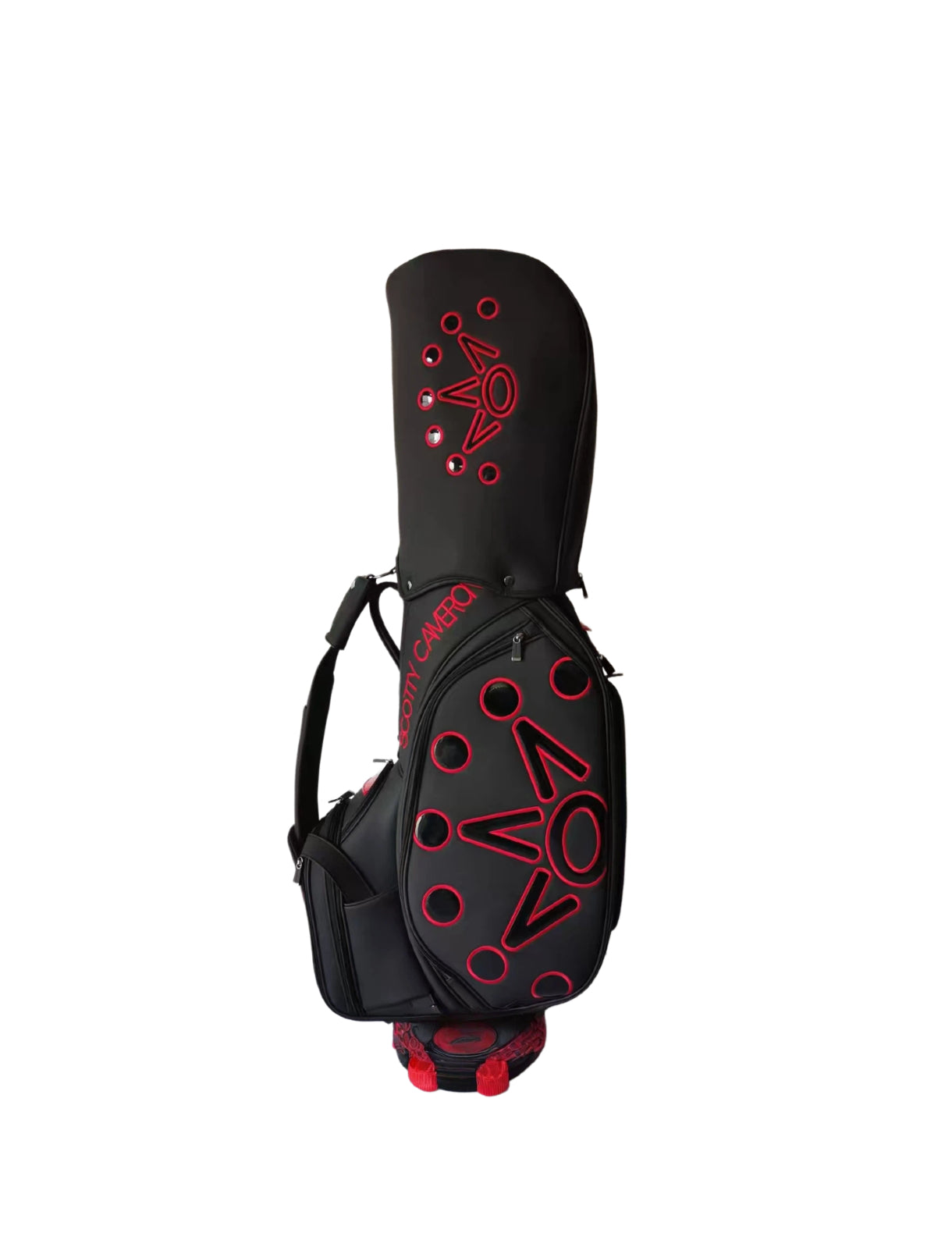 Angled front view of the Scotty Cameron Supercar Staff Bag in black, highlighting the large red "NOV" crown design, multiple storage pockets, and the integrated carry handle with red accents.