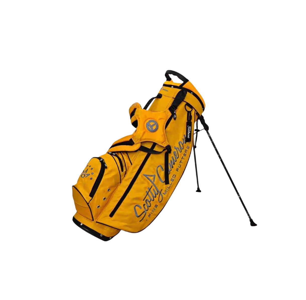 Angled view of the Scotty Cameron Supercar Stand Bag in vibrant yellow. Features the iconic "Scotty Cameron Fine Milled Putters" script, a grey Circle T logo on the strap, and a durable dual-leg stand system for stability on the course.