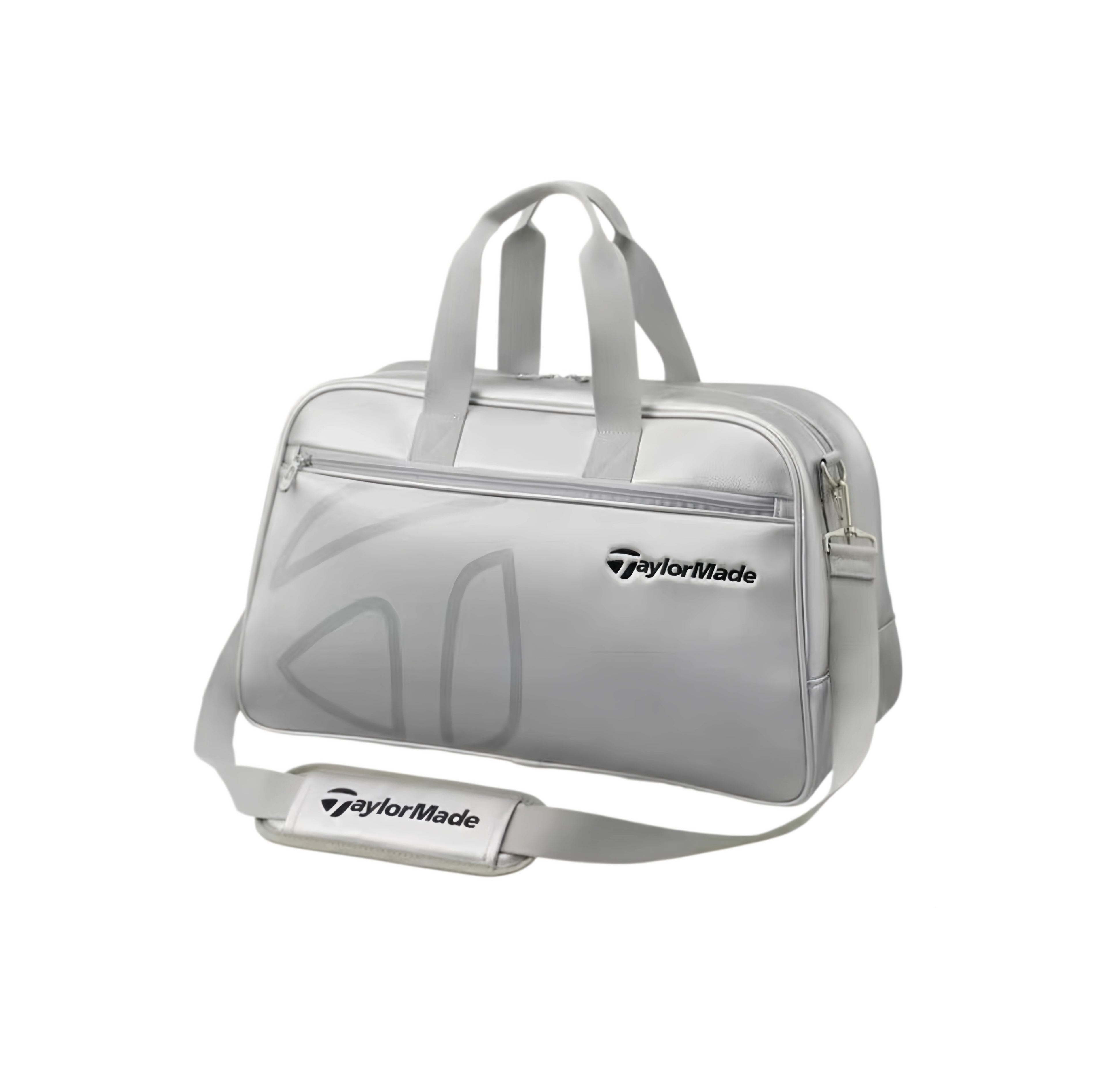 Full view of the TaylorMade Auth-Tech Boston bag in silver showcasing its sleek minimalist design, padded top handles, and detachable shoulder strap. Constructed from high-quality synthetic material with reinforced stitching for durability and long-lasting performance.