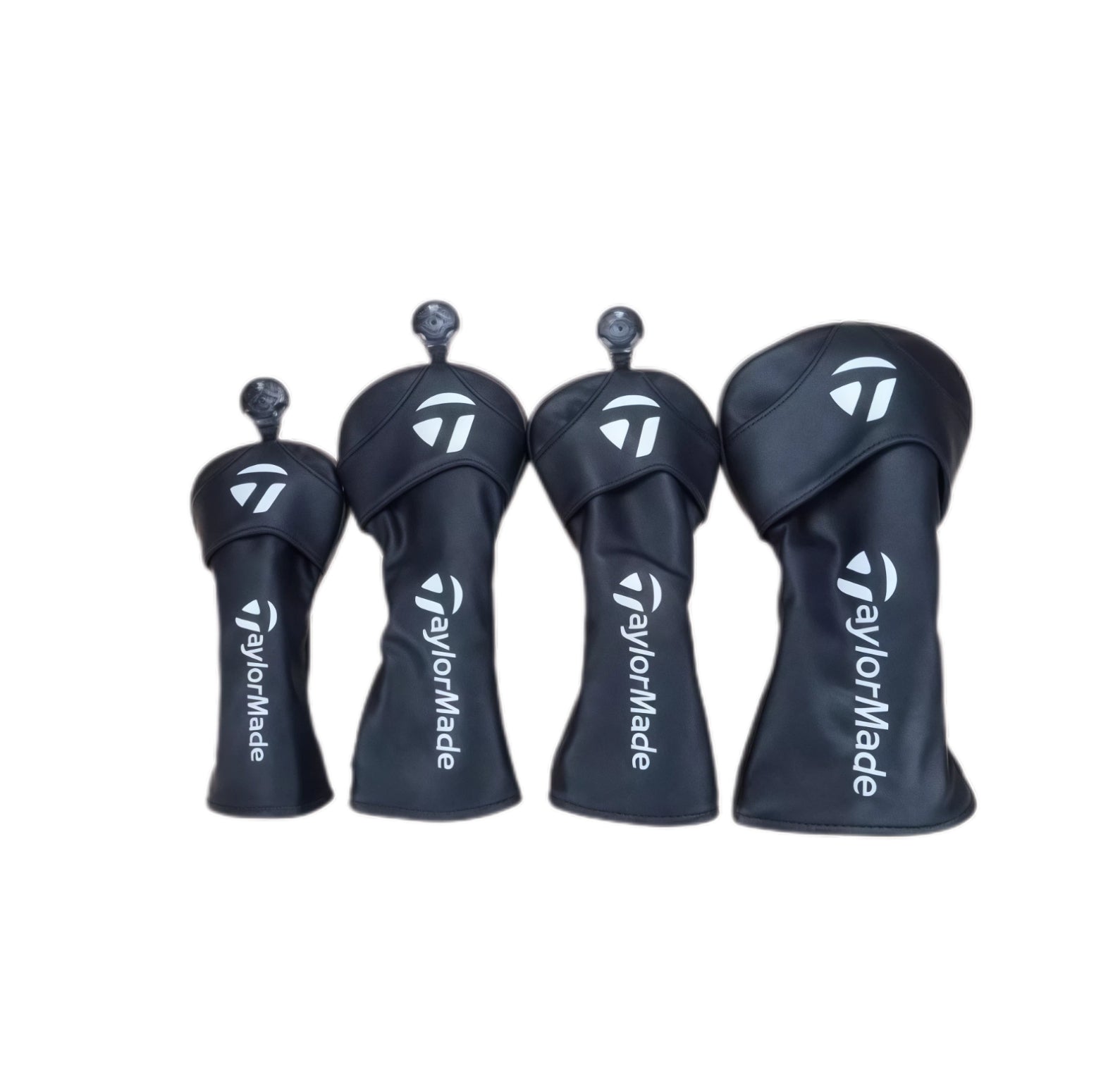 Four TaylorMade golf club headcovers on a white background