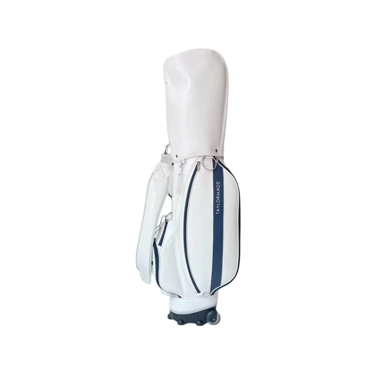 Back view of the TaylorMade wheeled golf caddy bag in white with a navy blue vertical stripe and "TAYLORMADE" branding. Features a sturdy carry handle, integrated wheel system, and sleek design ideal for golfers seeking style and functionality.
