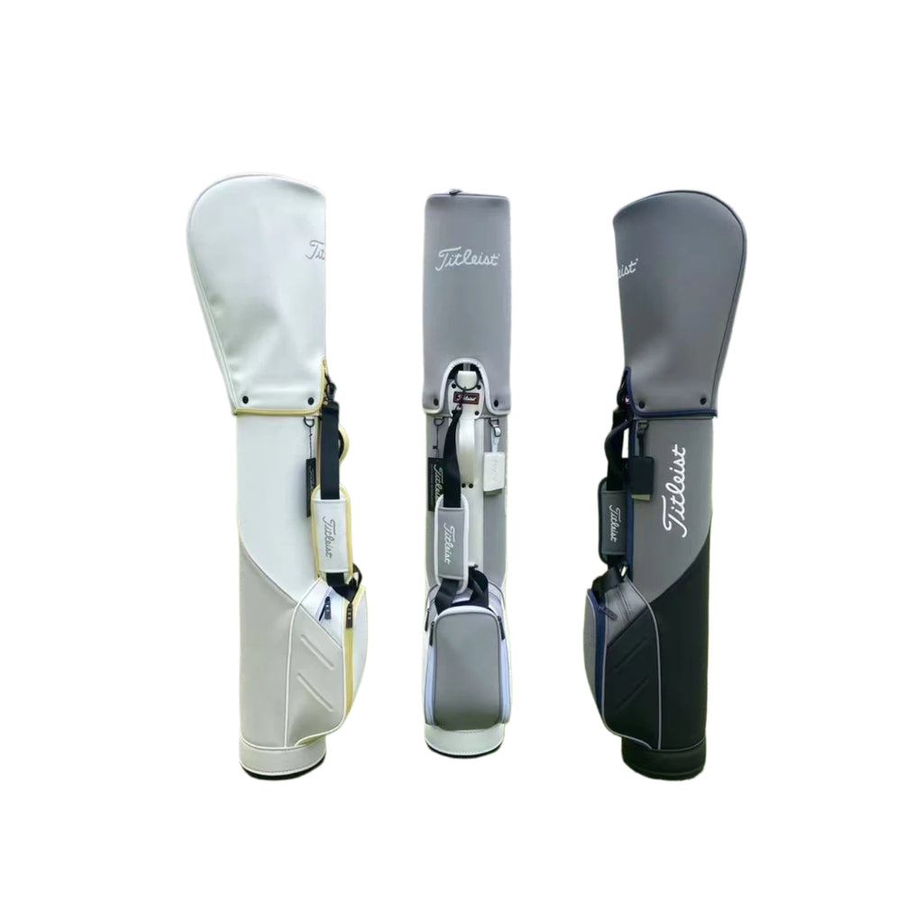 Back view of the Titleist Premium Sunday Carry Bag showing all three colorways: white/gold, light gray/silver, and dark gray/navy. Highlights the ergonomic shoulder strap and brand tag.
