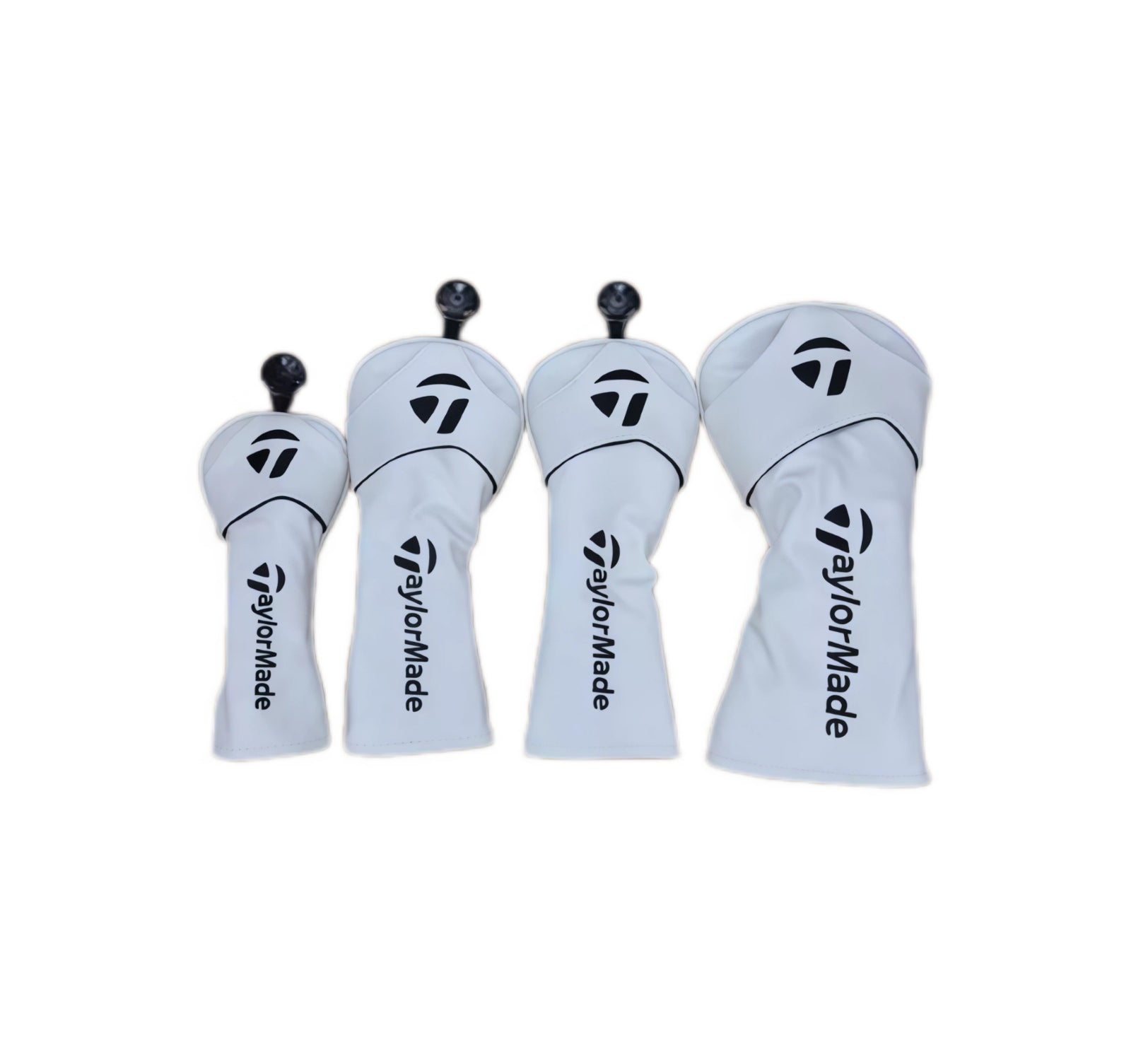 Set of four black universal golf wood headcovers compatible with TaylorMade drivers and fairway woods — displays white TaylorMade “T” logo on crown and vertical branding, with stretch-fit design for easy installation.