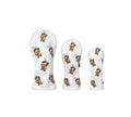 Front view of a white golf headcover set featuring three pieces with a playful orange cartoon tiger pattern, ideal for driver, fairway wood, and hybrid clubs. Soft fabric design for premium club protection.