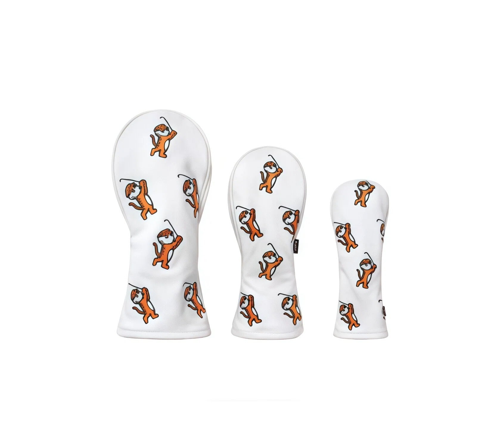 Front view of a white golf headcover set featuring three pieces with a playful orange cartoon tiger pattern, ideal for driver, fairway wood, and hybrid clubs. Soft fabric design for premium club protection.