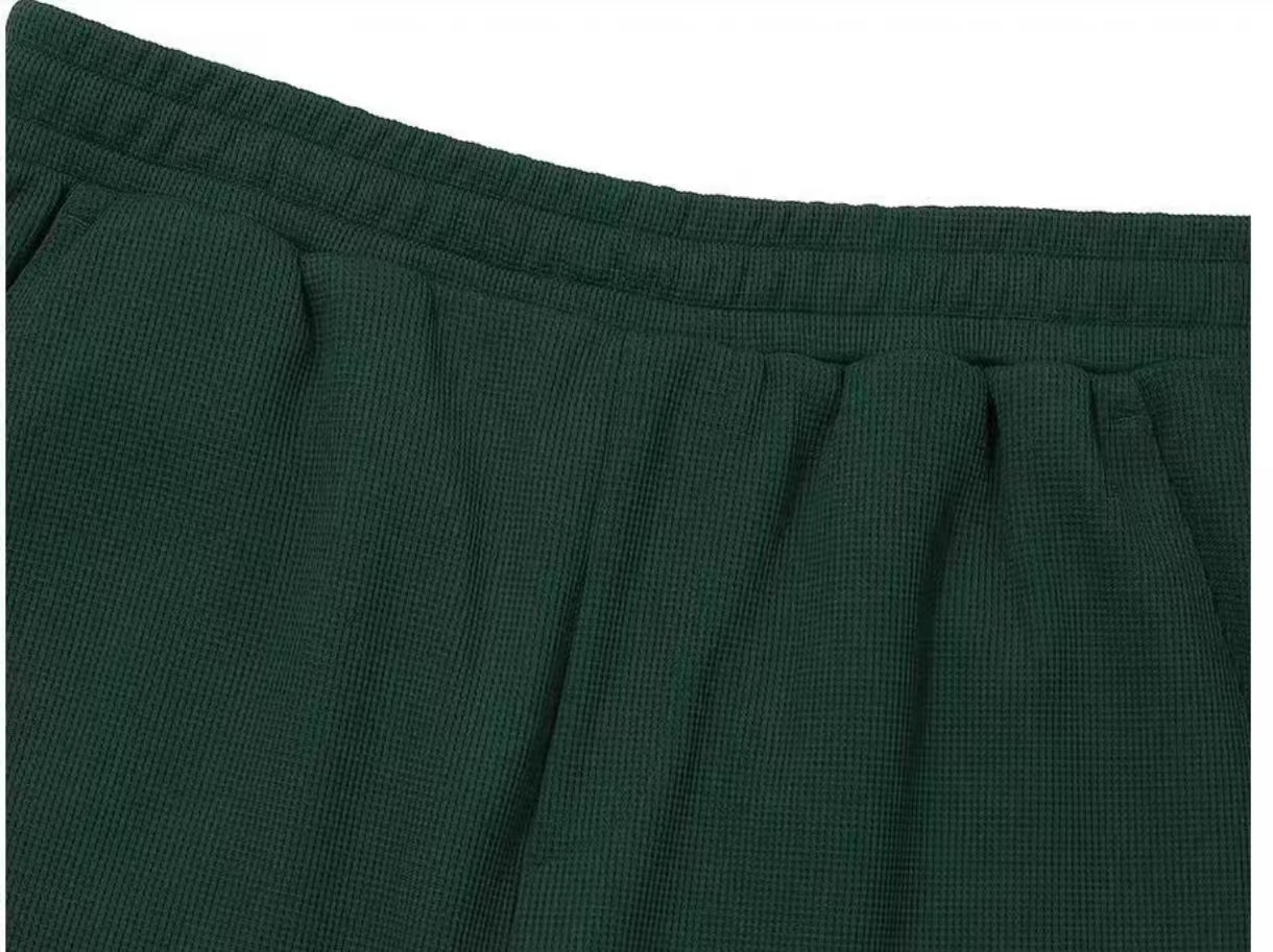 Malbon men's white golf shorts pocket detail