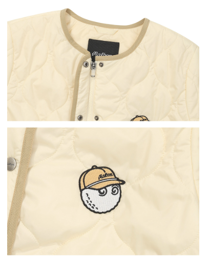 Malbon women's short-sleeve insulated padded golf jacket in Cream, collar and logo detail